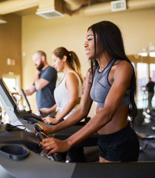 african-american-woman-using-treadmill-in-gym-with-2023-11-27-05-32-19-utc (1)